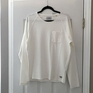 Men’s white Produkt shirt.